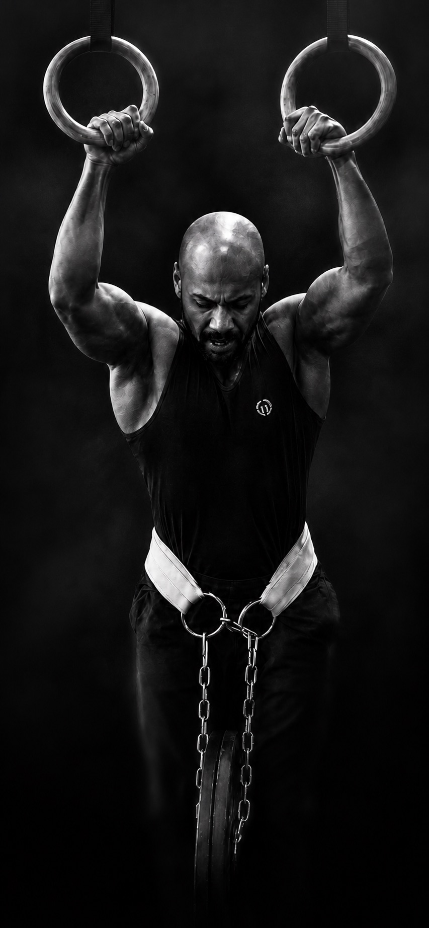 Athlete training weighted strength on rings
